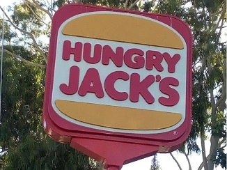 photo of the Hungry Jacks sign were boys were sitting just after 12pm eating